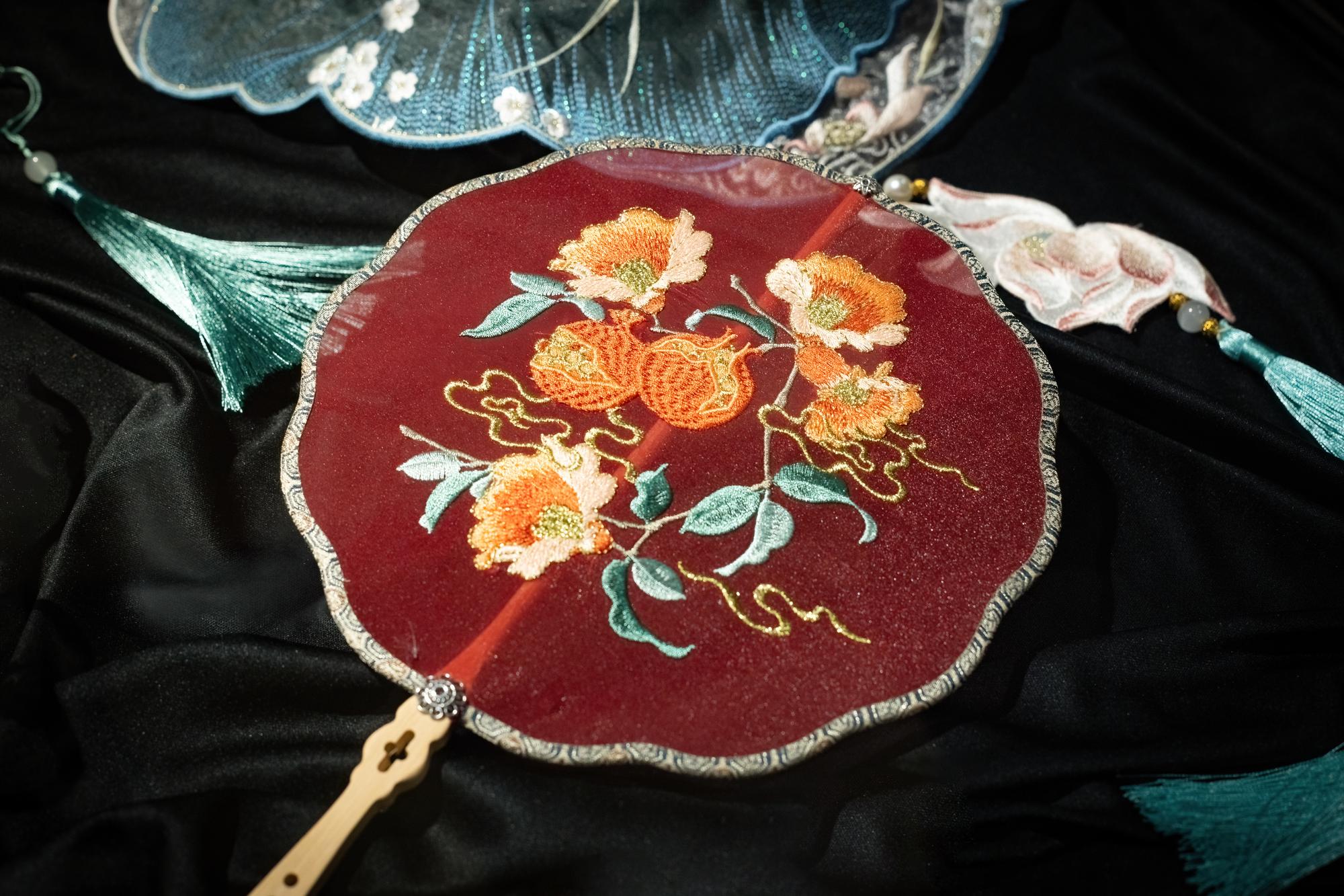 Close-up of bead-embellished embroidered crest